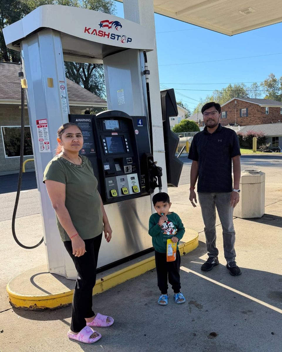 Kash Stop's owner and his family at the pumps